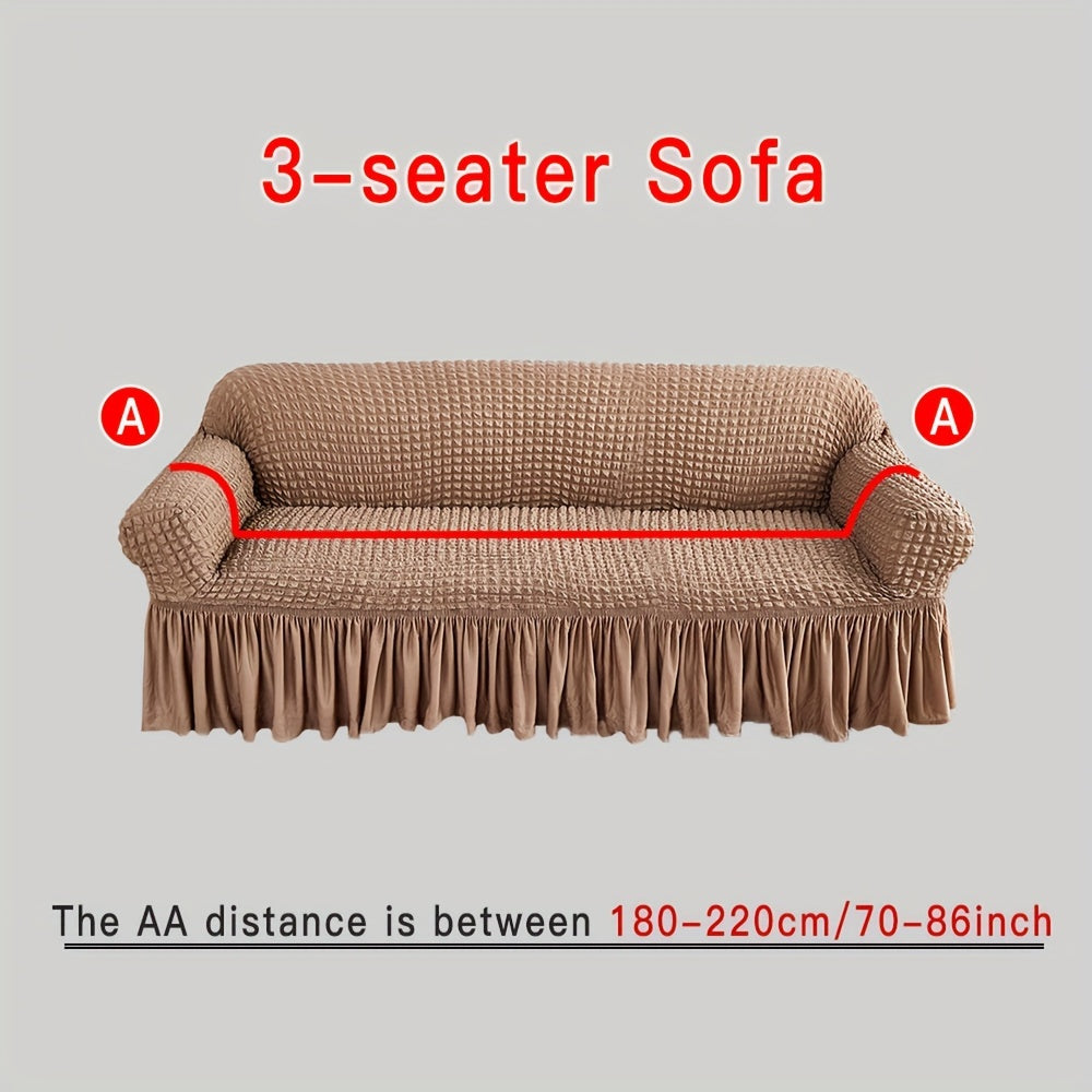 Stylish beige sofa cover with elastic skirt. Fits all sofa sizes and is machine washable. Perfect for any room decor. Great for living room sofas.