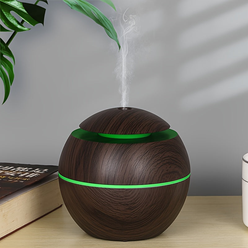 Quiet USB-powered cold mist humidifier and essential oil diffuser, ideal for bedroom, office, living room, and travel during winter and autumn. Portable and easy to clean.