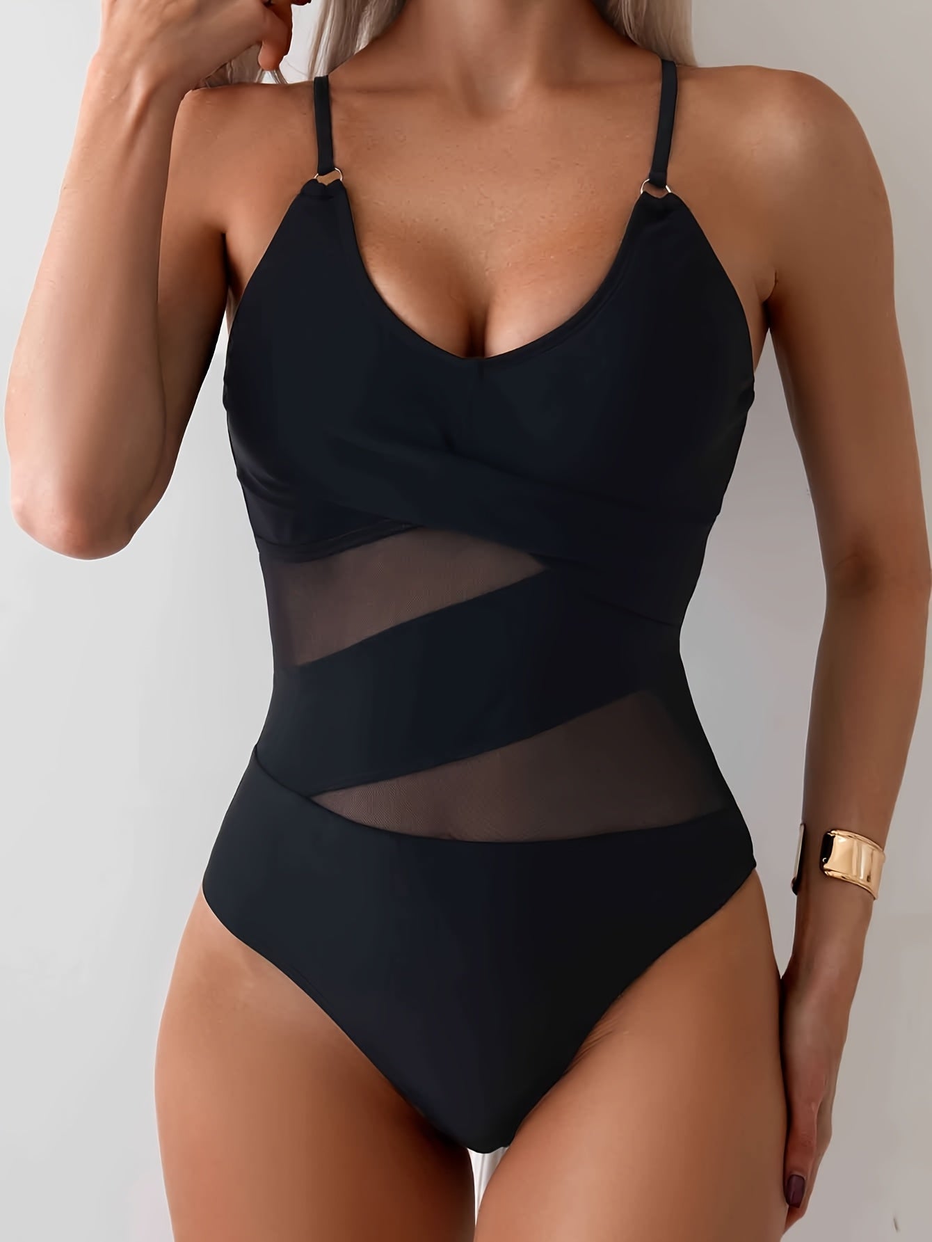 Stylish one-piece swimsuit for women with removable pads, high stretch, nylon & elastane blend, mesh detail, solid color.