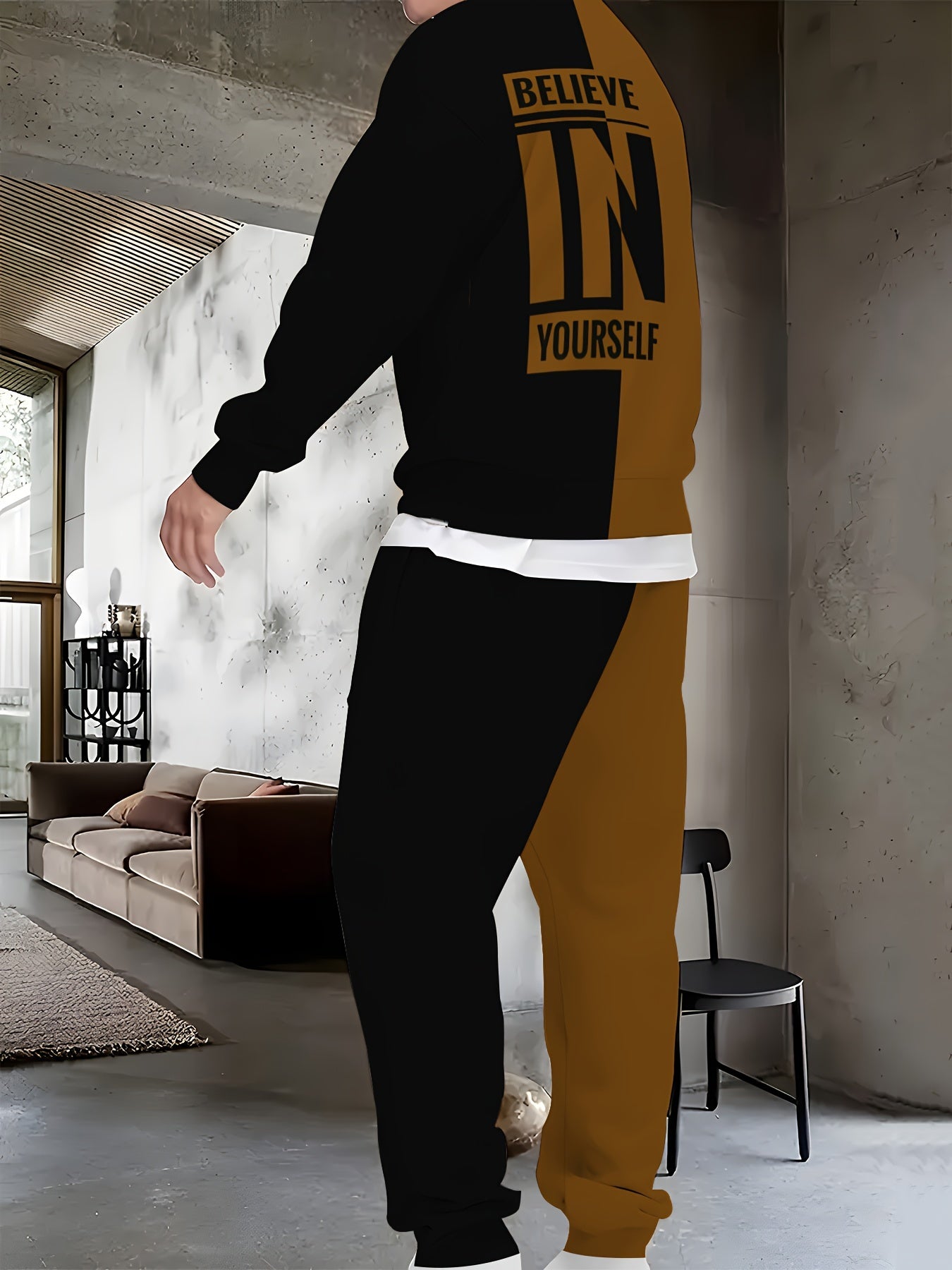 Men's polyester knit tracksuit featuring a crew neck long sleeve sweatshirt and joggers with "BELIEVE IN YOURSELF" print, offering a comfortable slight stretch in a two-piece outfit.