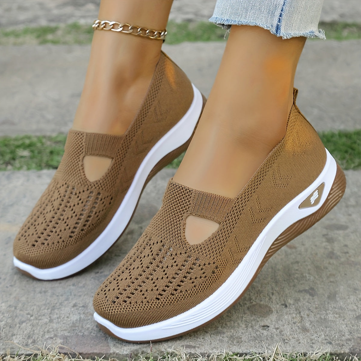 Breathable mesh slip-on sneakers with PVC sole, fabric insole, and lining for stability and comfort. Perfect for casual outdoor wear in spring and summer. Features cut-out patterns and