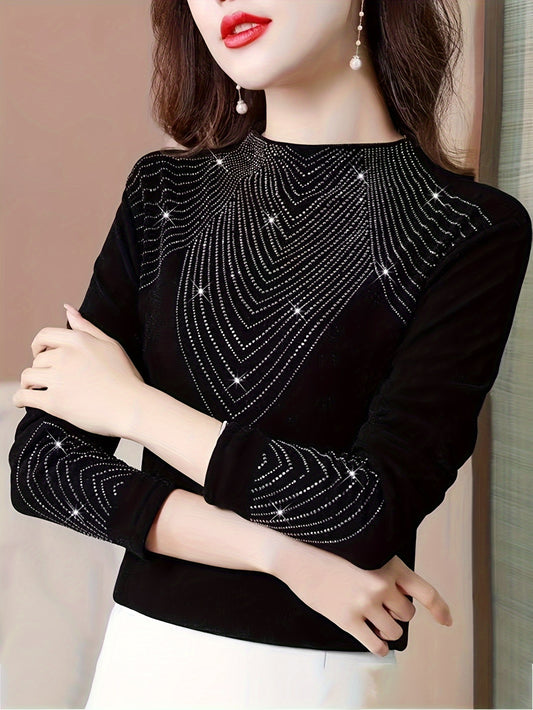 Stylish women's sweater with rhinestone decoration, cozy for colder seasons.