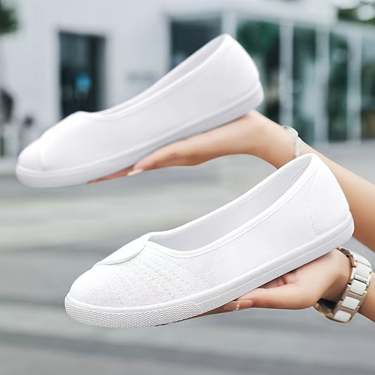 Women's white slip-on sneakers with breathable fabric upper, rubber sole, round toe, and sporty design.