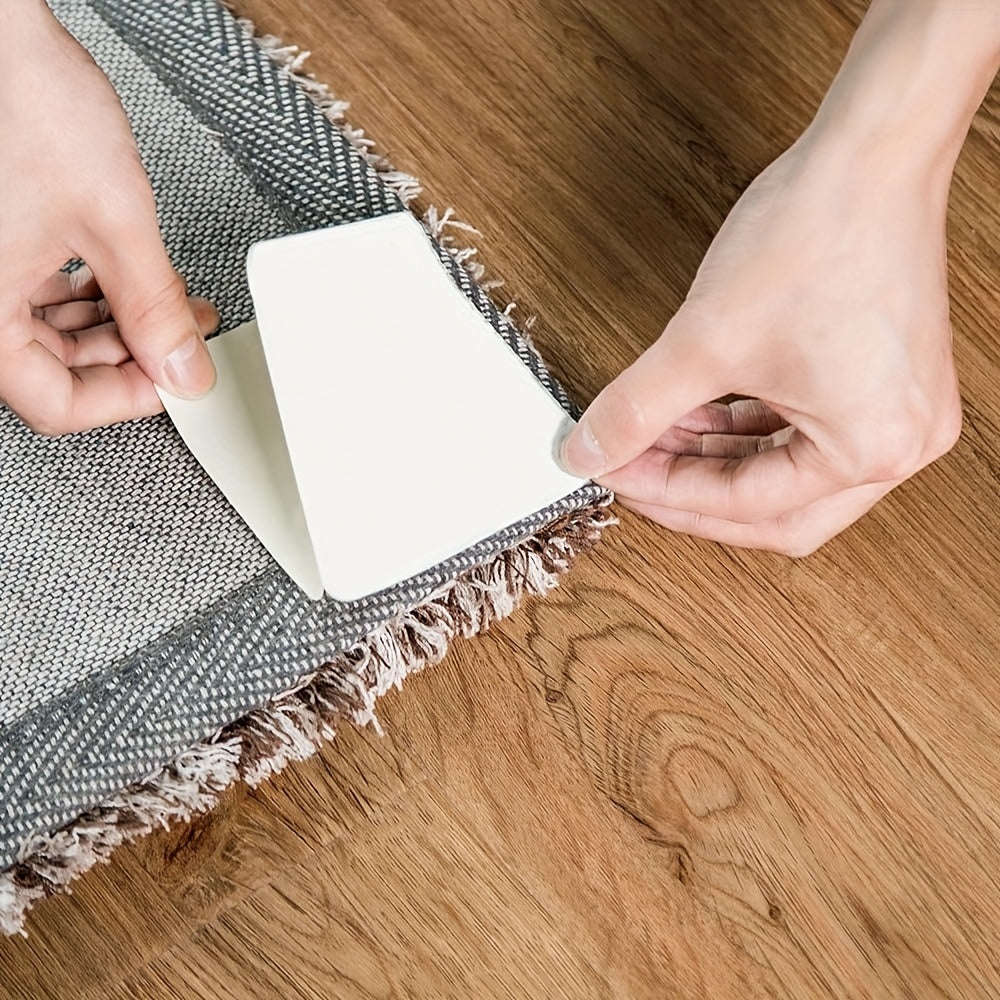 Secure your rugs on hardwood floors with these 4 pieces of non-slip, washable plastic carpet tape. Perfect for office, indoor, or room use, these rug gripper pads will keep your rugs flat and in place. Ideal for placing under the rug or in the corners.