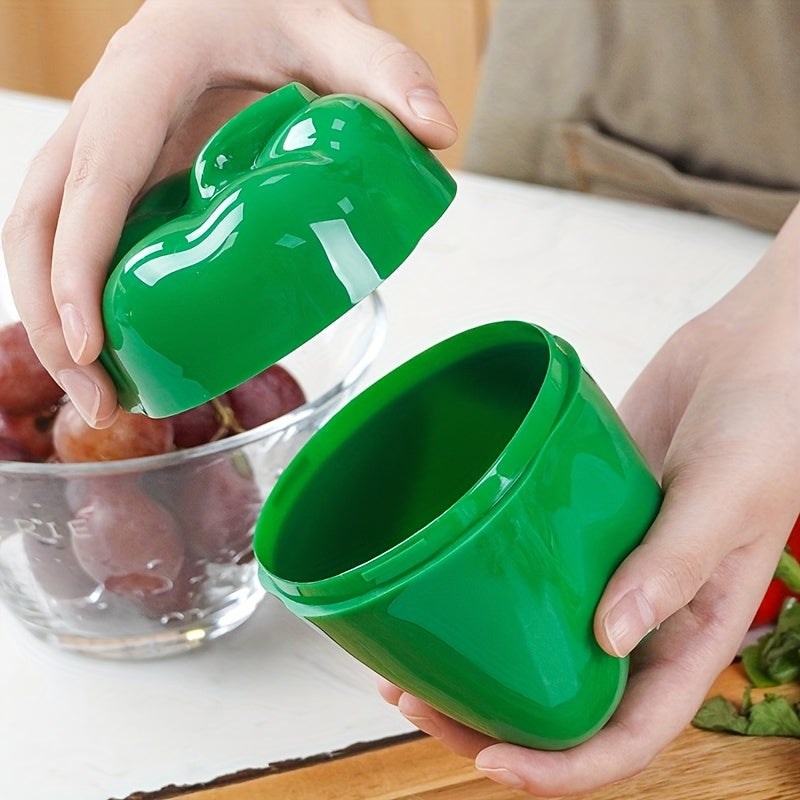 Food storage container in the shape of a green pepper, made of reusable and hand-washable plastic with a flip-top lid. Perfect for storing fresh veggies and other items in the kitchen. Can be used as a multifunctional organizer on the countertop.