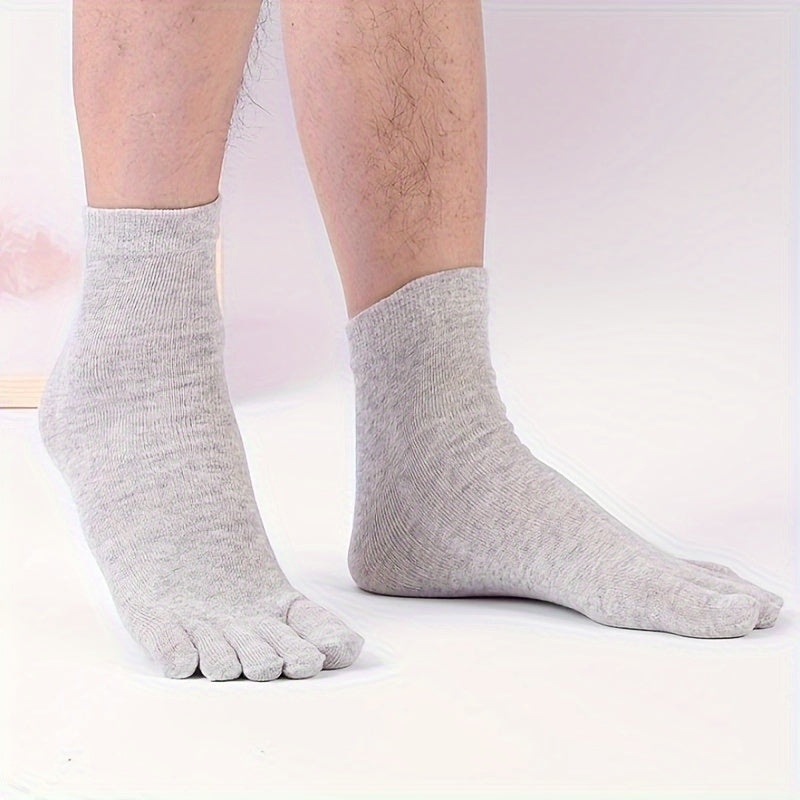 10 pairs of men's mid-calf split toe socks in solid colors.