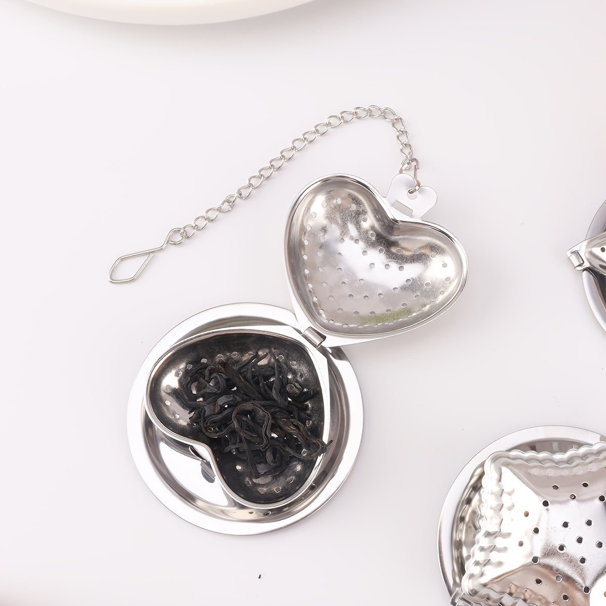 Set of 1 Stainless Steel Hanging Cup Filter Tea Ball with Tray, Available in Heart, Star, and Moon Shapes. Perfect for Ramadan Tea Time. These Creative Tea Balls in Various Shapes are Ideal for Office, Kitchen, Baking, and Special Occasions like Ramadan