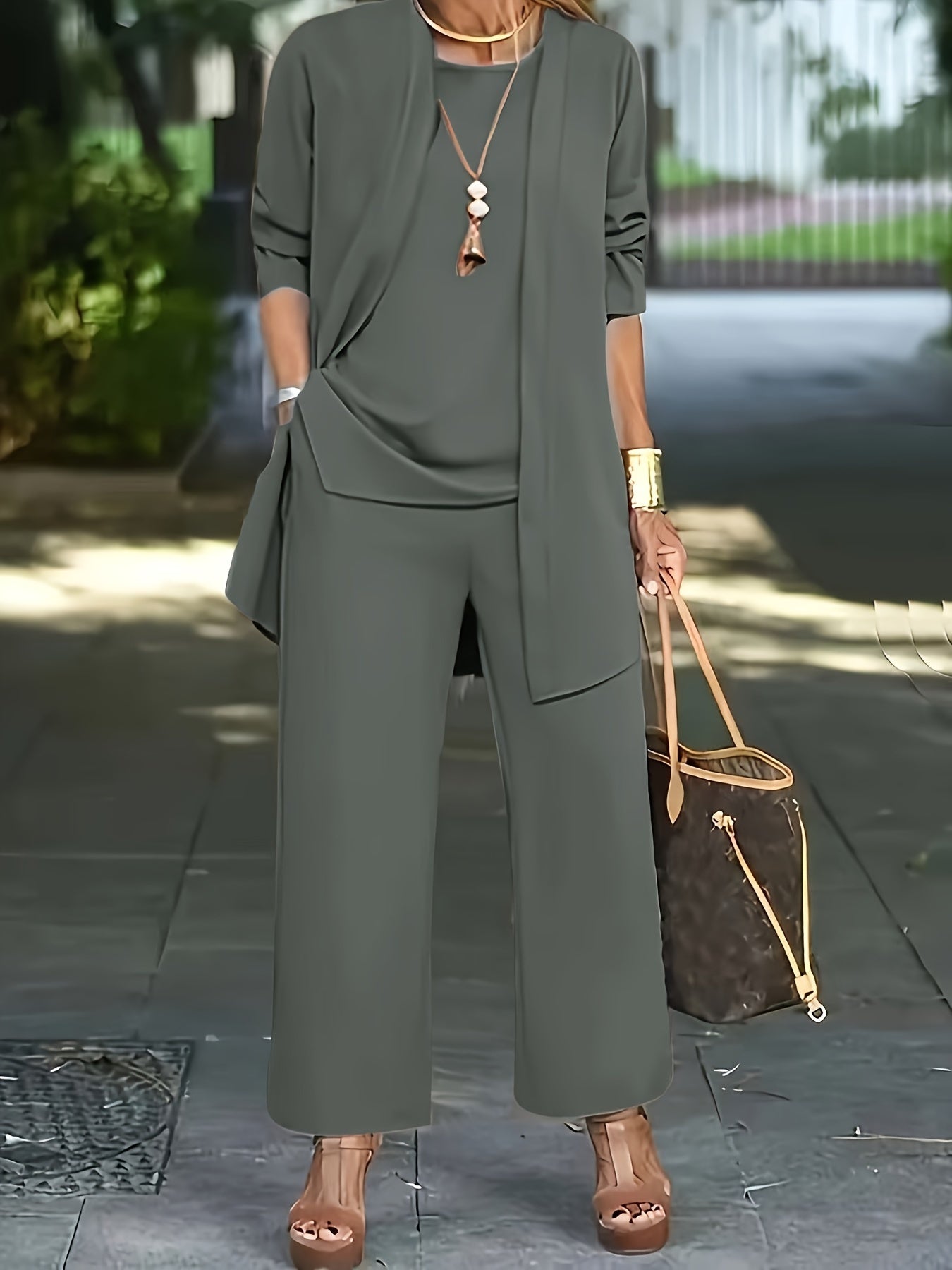 Women's suit set includes solid color split round neck sleeveless vest top, long sleeve open coat, and wide leg pants.