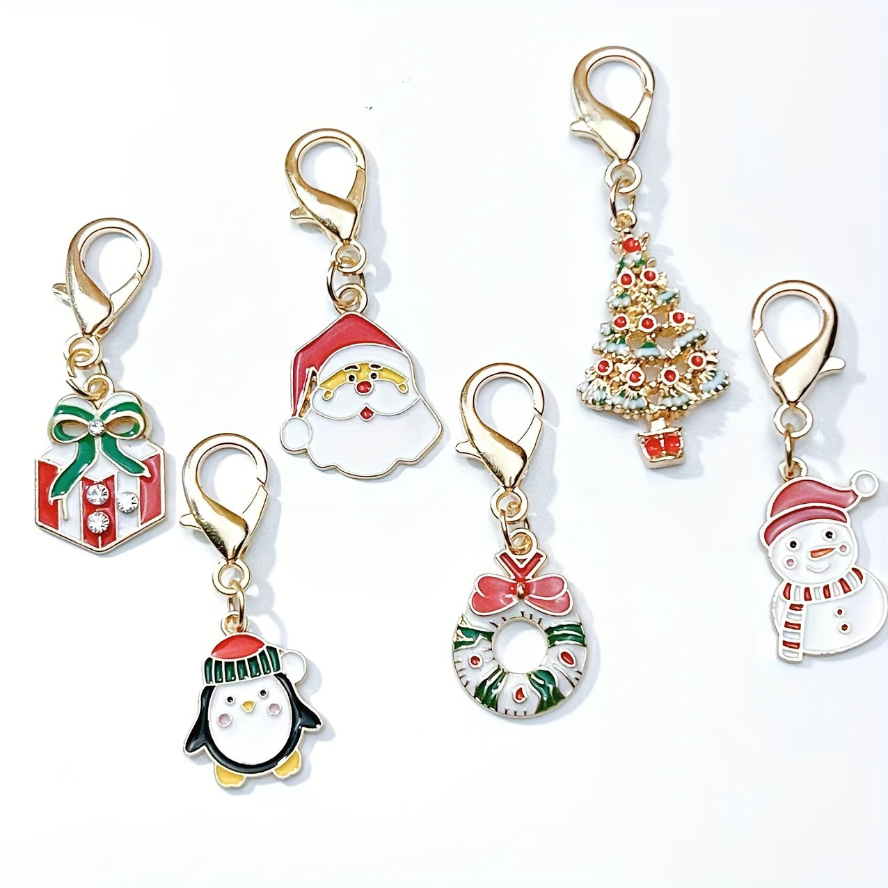 Six Christmas keychain charms made of zinc alloy with festive keyrings. These non-plated metal bag pendants are simple in style and perfect as holiday gifts for friends.