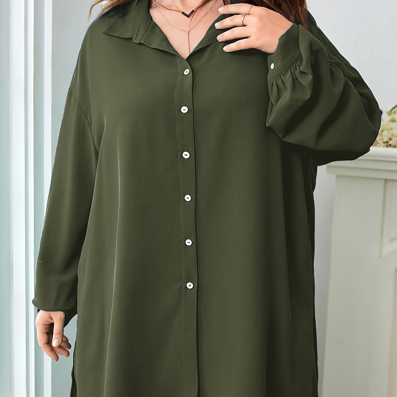 Black polyester blend pants with split details and a relaxed blouse comprise an elegant oversized V-neck two-piece set.