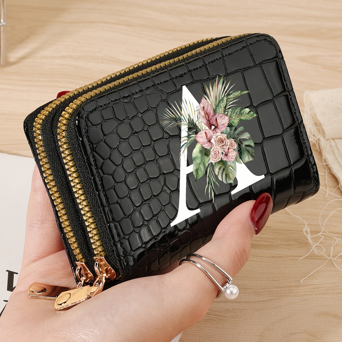 Women's credit card wallet with elegant floral letter print in black & white. Features large capacity, dual zipper, crocodile texture PU, lightweight design with nylon lining for everyday