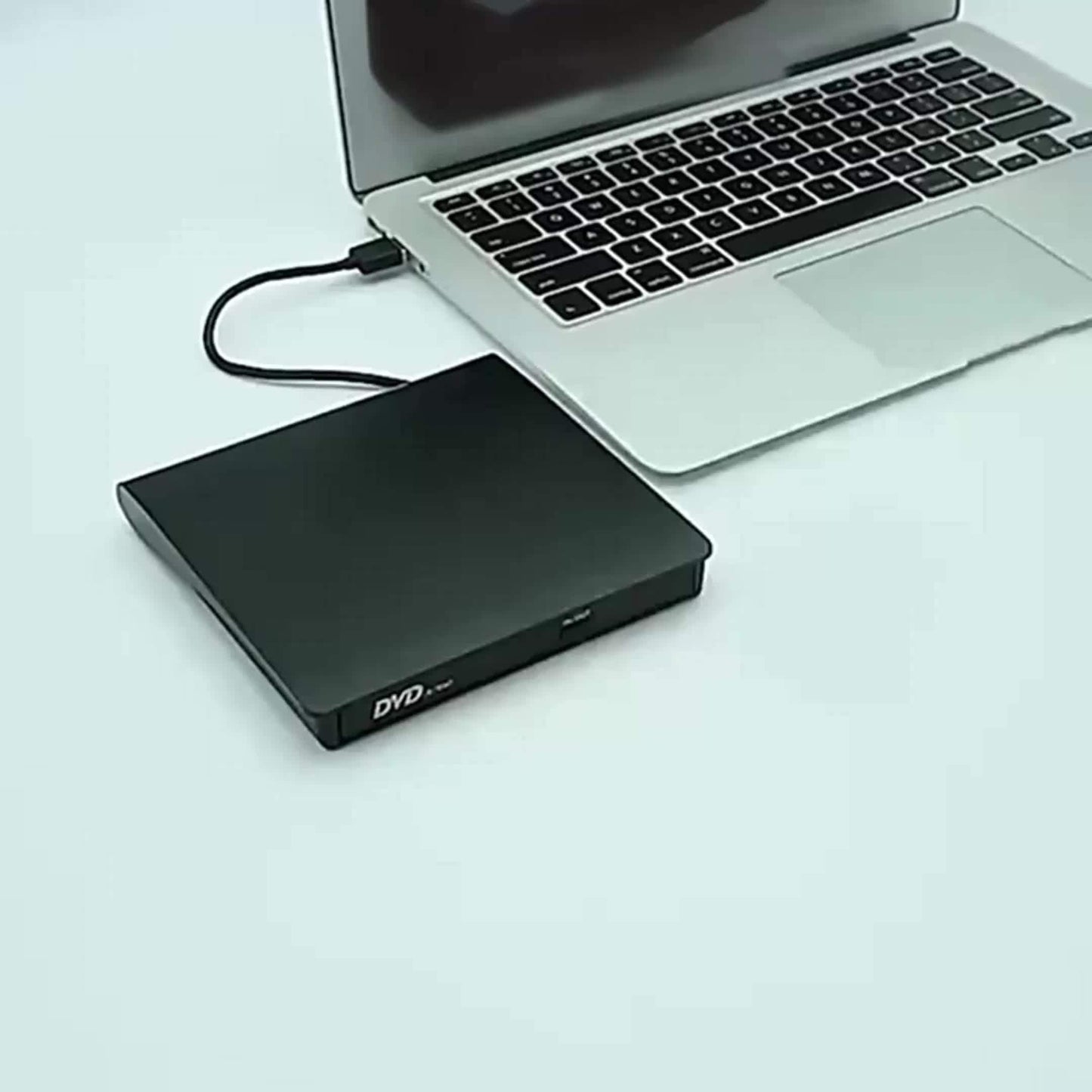 Portable CD/DVD-ROM drive for laptops and desktop computers with storage bag included.