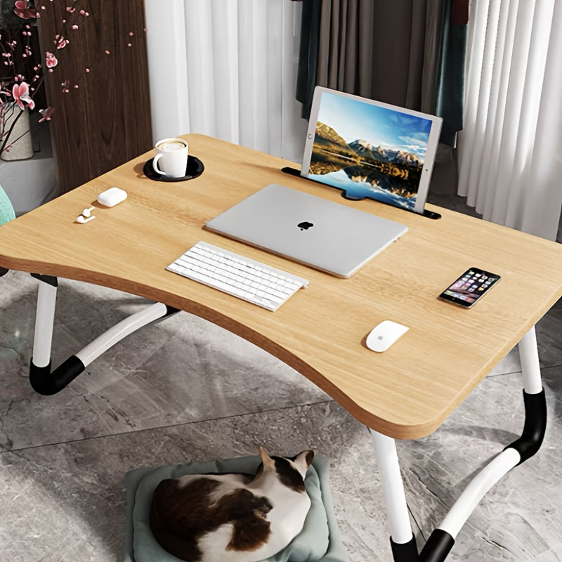 Large portable laptop desk with folding design, featuring multifunctional tray, cup holder, drawer, USB port, fan, and light. Made of durable aluminum alloy, suitable for use on bed, sofa