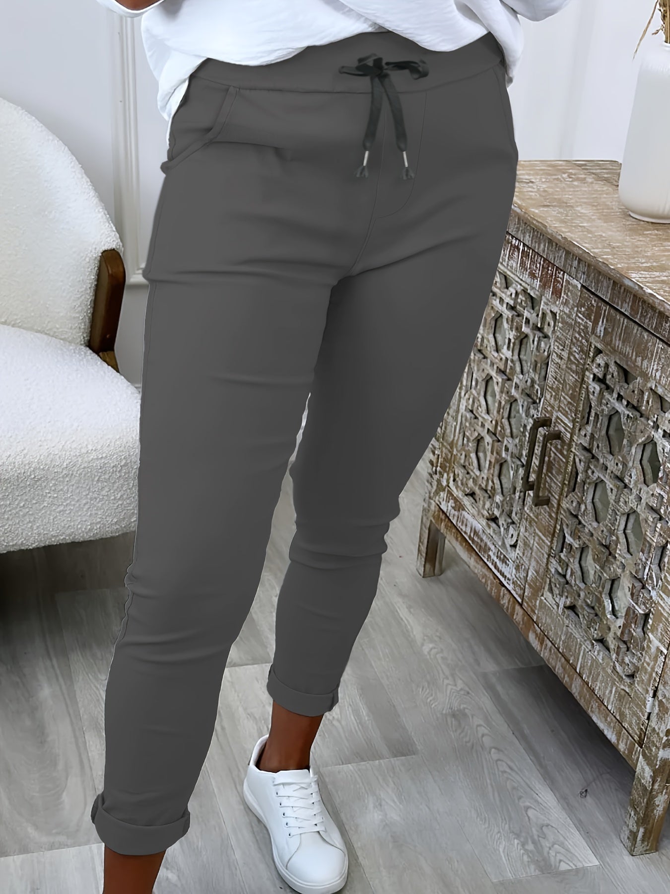 Women's comfortable jogger pants made of stretchy polyester with a drawstring waist, solid color, and machine washable for all-season wear.