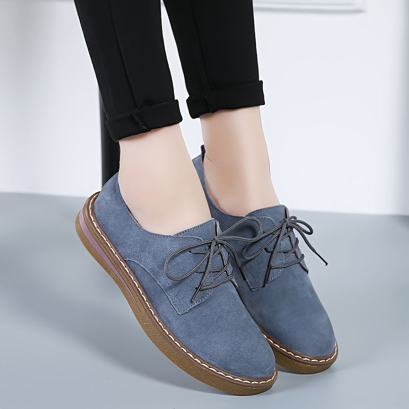 Women's flat, lace-up loafers in solid color, perfect for back to school with a comfortable preppy style.