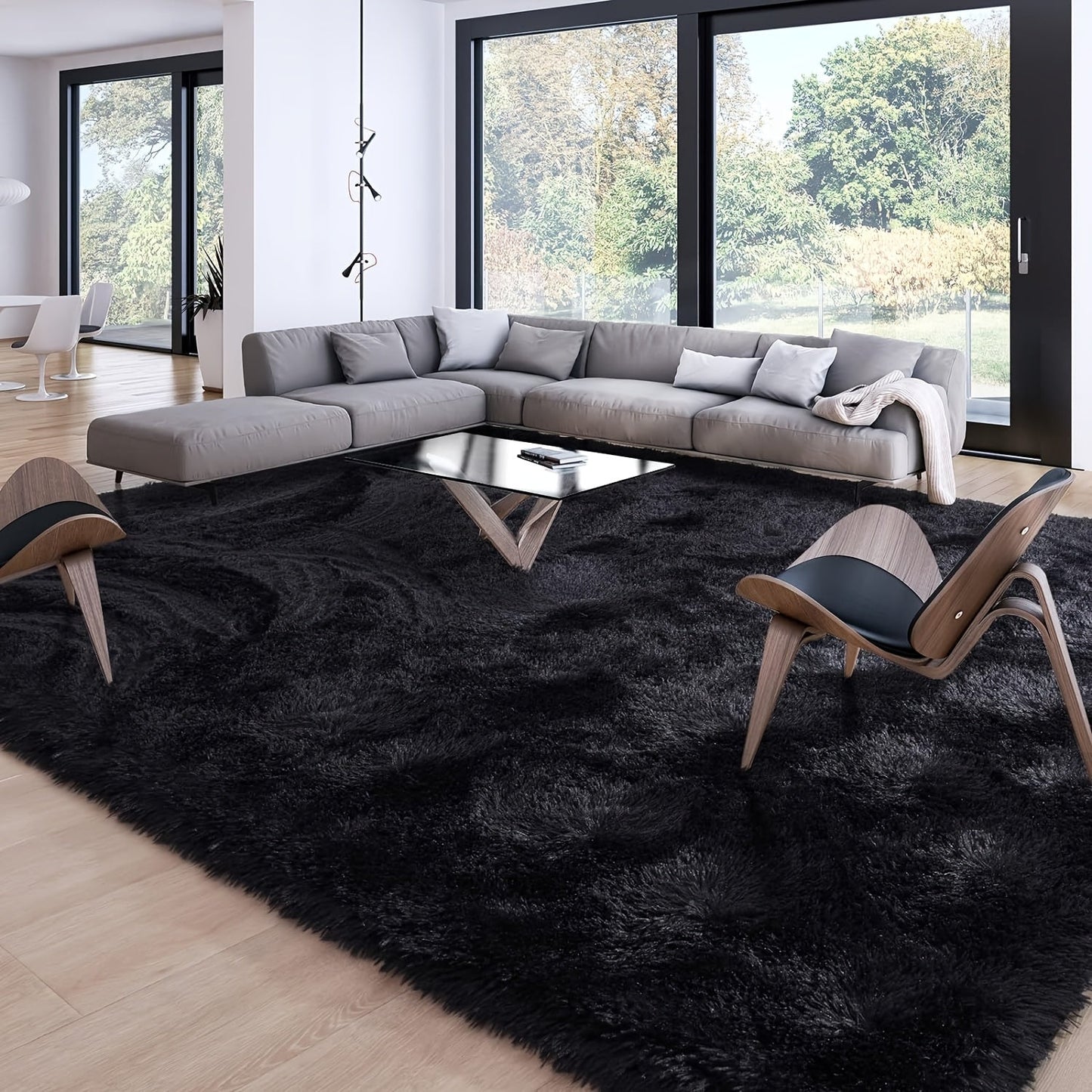 1 piece of Fluffy Black Shag Area Rug, made with extra soft and shaggy materials. Perfect for adding a cozy touch to your bedroom, living room, or outdoor space. Great for home decor.