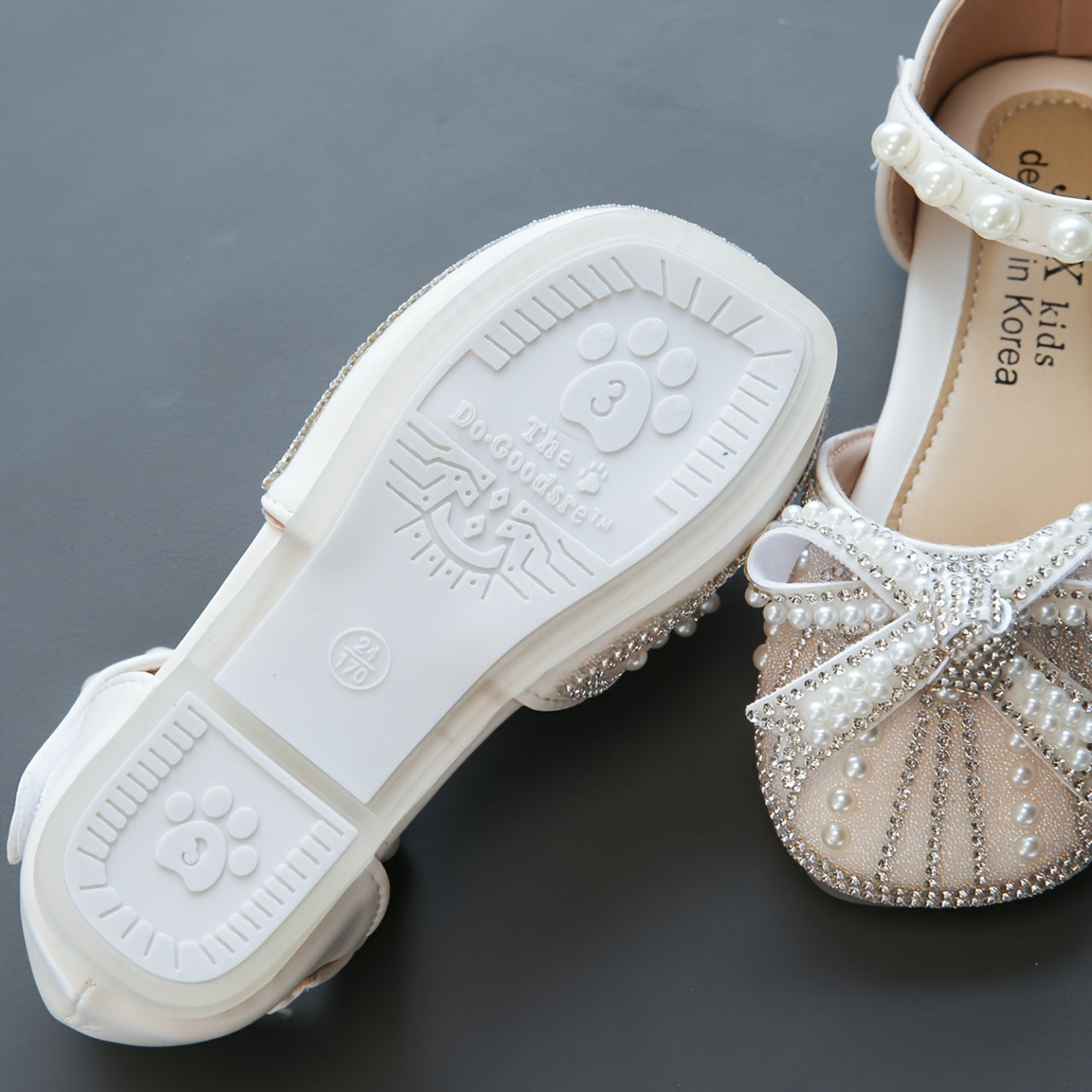 Sparkly bowknot flats with adjustable strap, durable TPR sole, comfortable for daily wear for girls aged 14 and under.