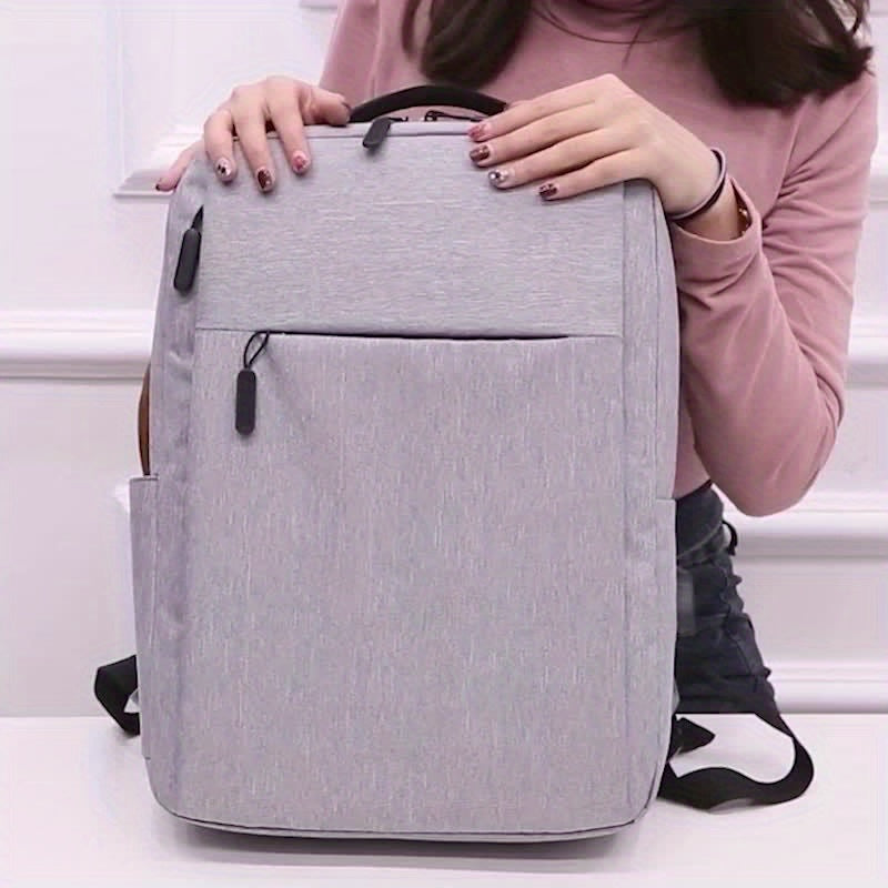 Grey laptop backpack with adjustable strap, zipper closure, and lace-up design. Perfect for school, outdoor, or as a Valentines gift.