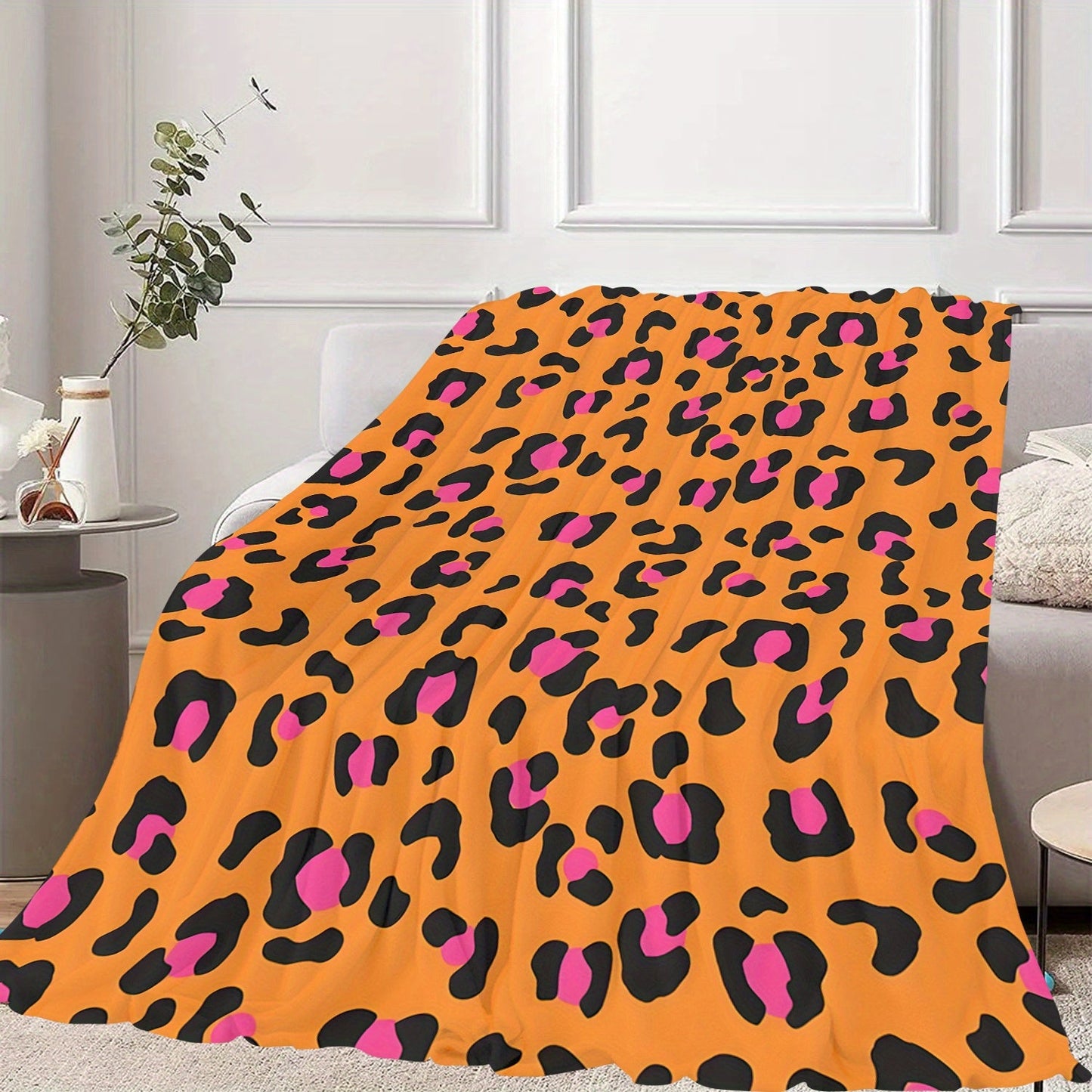 Soft and cozy flannel fleece blanket with a contemporary design. Suitable for all seasons, this blanket is machine washable and features a digital print orange leopard pattern. Made with a polyester cover, this warm plush blanket weighs 200-250gsm and is