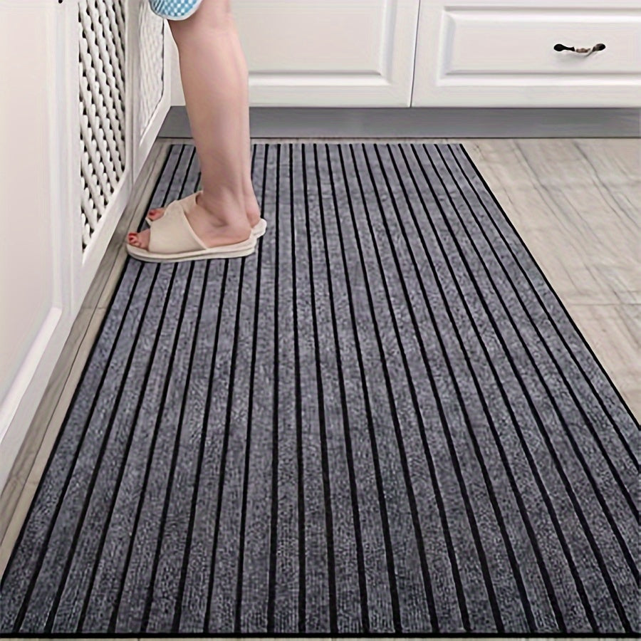 Household mat in gray stripes, designed to prevent slipping and repel dust and stains. Suitable for indoor, kitchen, and bedroom use. Can be cut to size with options available in various dimensions (101.6cm x 152.4cm, 127.0cm x 203.2cm, 114.3cm x 3.05m