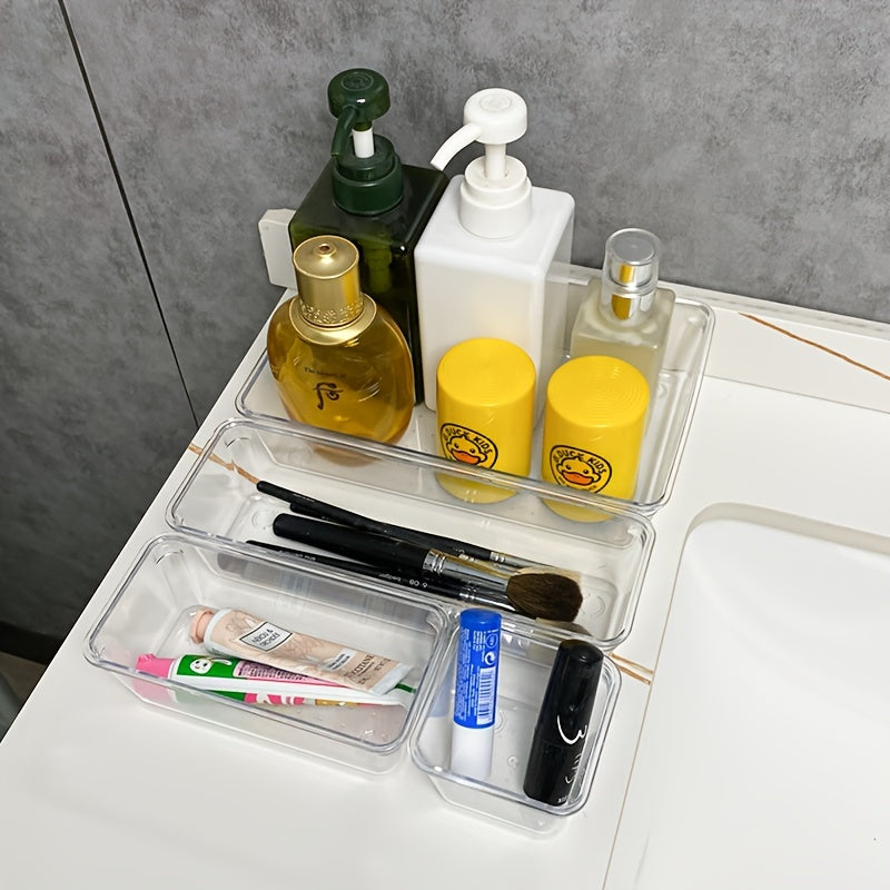 Clear plastic drawer organizers set includes 7-18 pieces in 4 sizes for versatile organization in bathroom, vanity, makeup, bedroom, kitchen, and office.