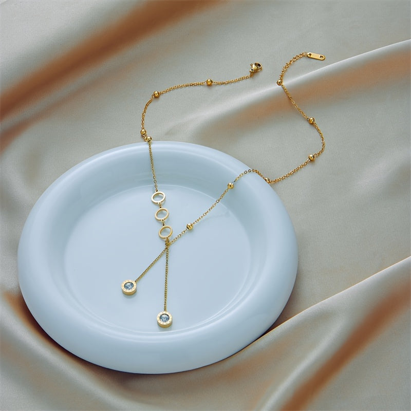 Get a touch of elegance with the 1 Pc Golden Stainless Steel Circle Pendant Necklace, a luxurious and stylish accessory perfect for any occasion. This sexy minimalist design adds a trendy touch to your look, making it a versatile choice for streetwear