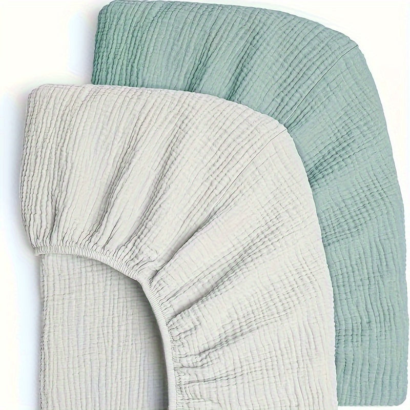 Two breathable muslin bassinet sheets for boys and girls. These cozy sheets provide an elastic fit for both oval and rectangle mattresses, and come in vibrant colors.