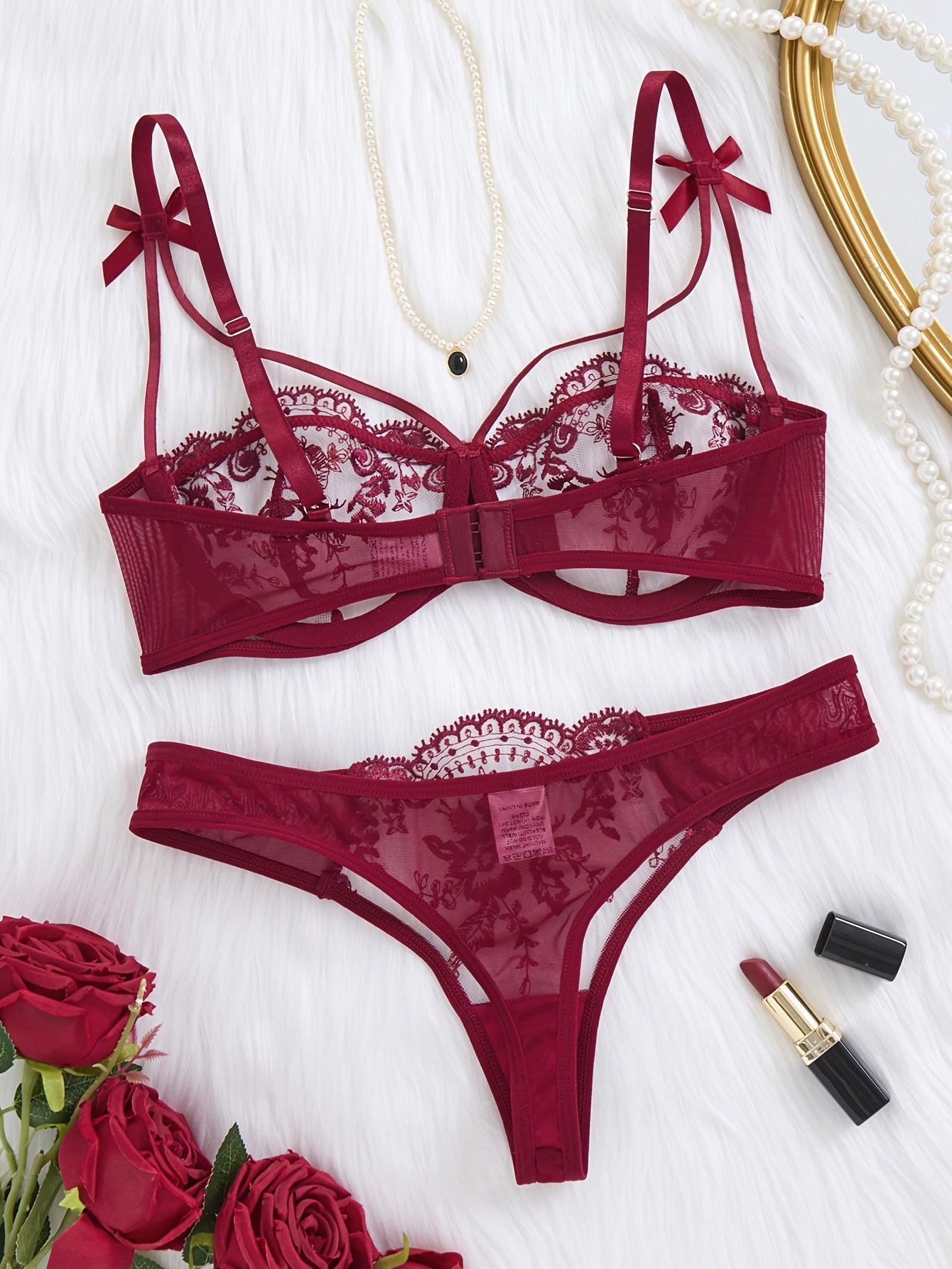 Floral embroidered two-piece bra set with semi-transparent fabric.