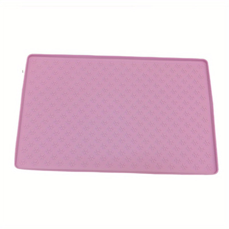 Silicone pet food mat with raised edge.