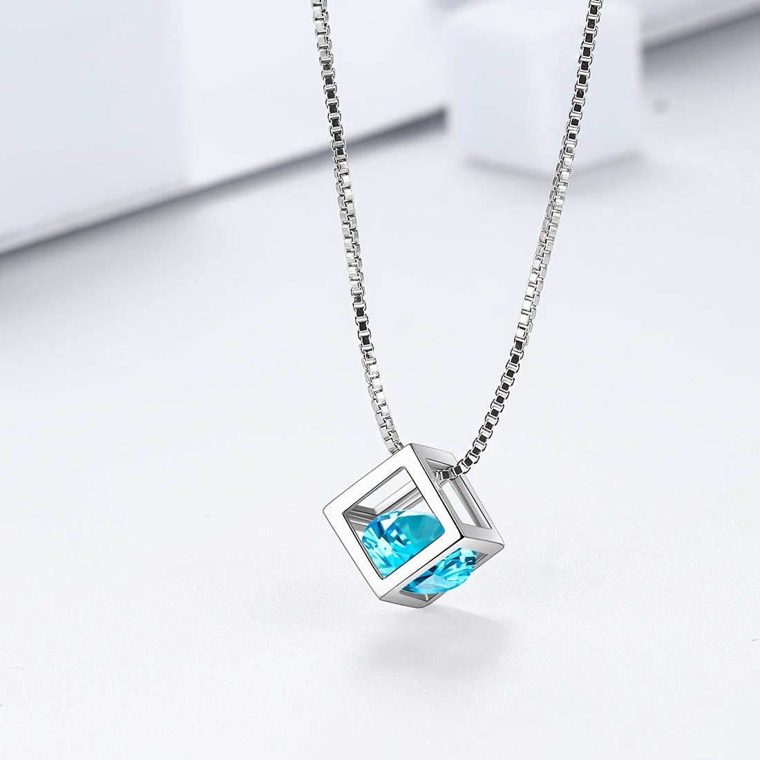 Necklace crafted from 925 Sterling Silver with a 3D Cube Crystal Pendant and Cubic Zirconia accents. Perfect for women, this piece of jewelry exudes elegance and style in a stunning silvery hue.