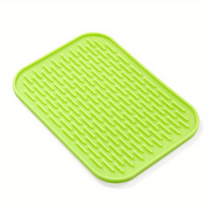 High-quality silicone drying mat for dishes, heat-resistant and non-slip, protects kitchen surfaces, versatile trivet, 21.59cm x 16.0cm, come in vibrant colors.