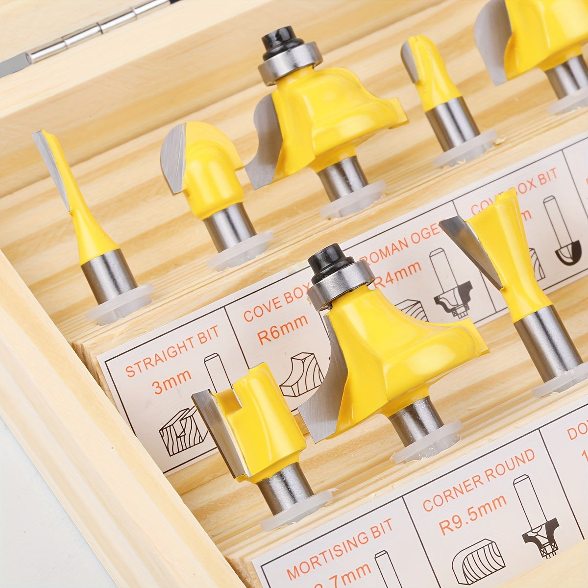 Set of 15 6mm router bits with 1/4" and 8mm shanks for woodworking in a wooden case. Ideal for trimming, slotting, and engraving wood with tungsten carbide milling cutters.