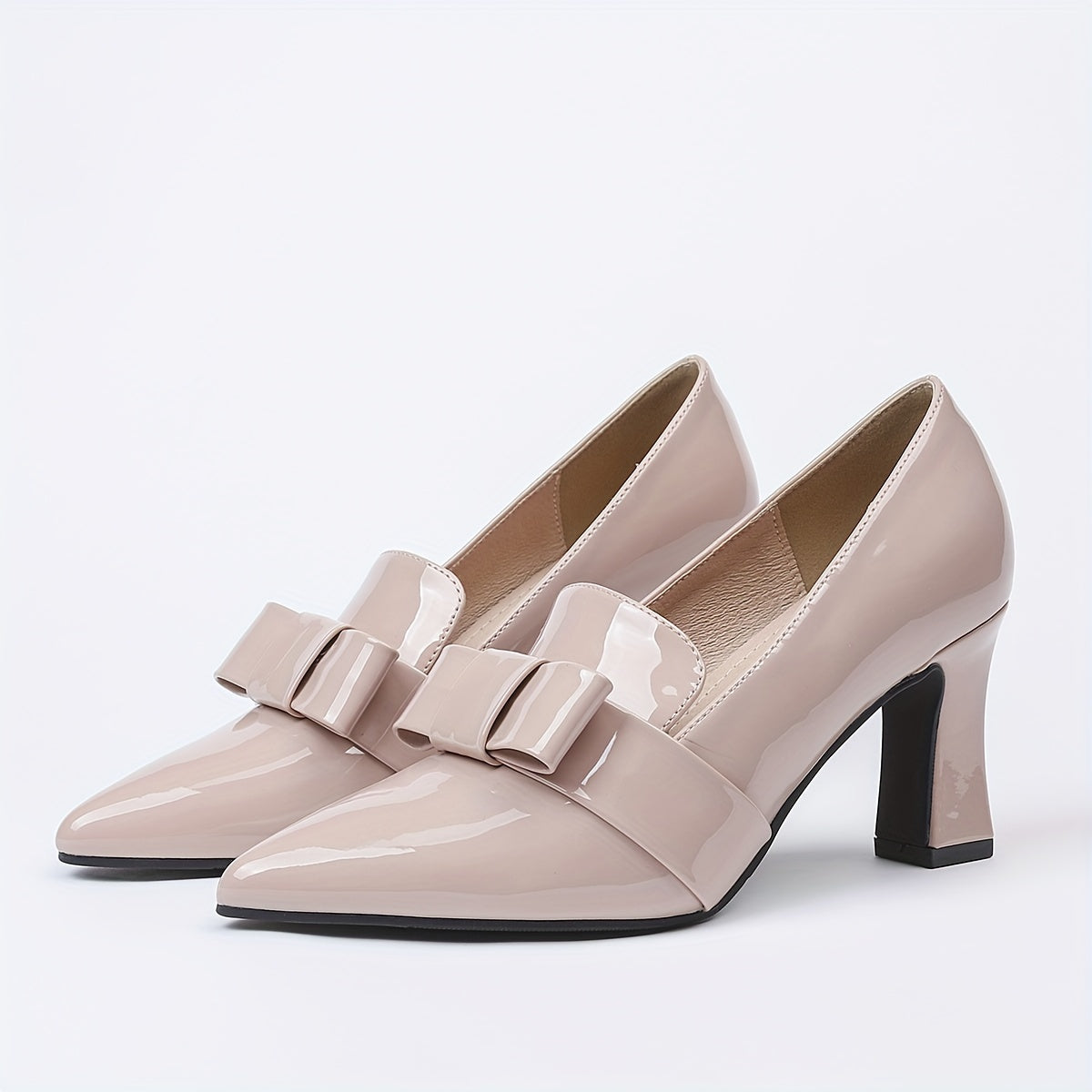 Women's elegant solid color pumps with bowknot design, block heel and waterproof features.