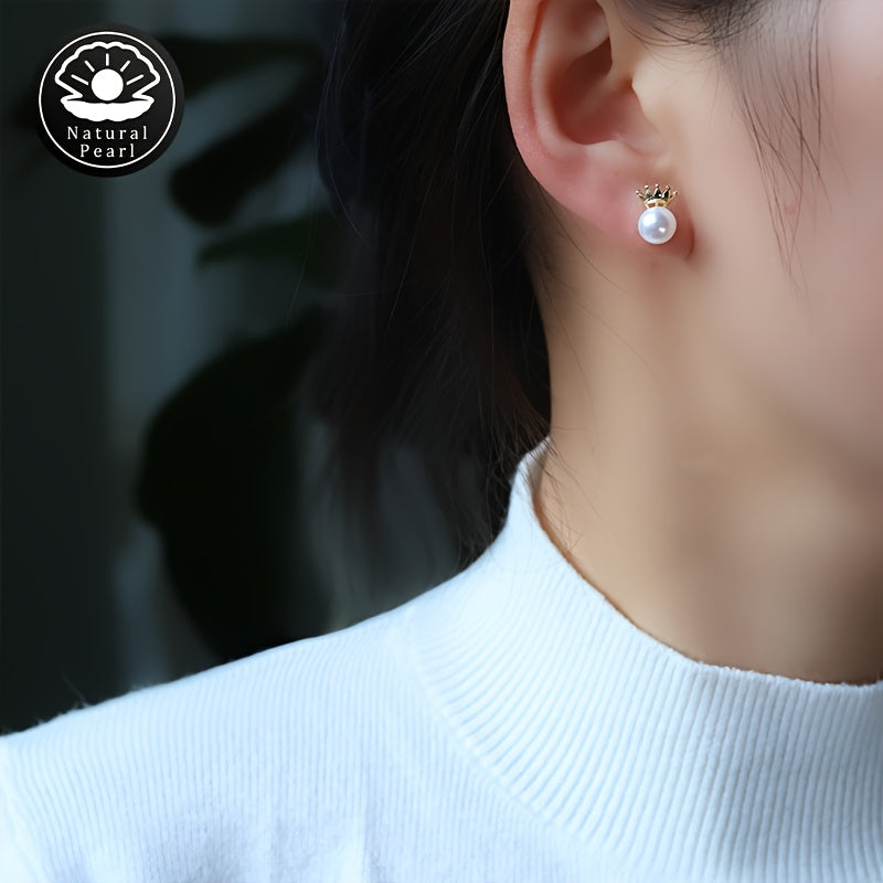 These MUFAN Elegant Luxury Stud Earrings feature a pair of 7-8mm Flat Round Natural Freshwater Pearls adorned with a Small Crown design. They are the perfect June Birthstone accessory for daily wear or gifting, making them a versatile choice for all