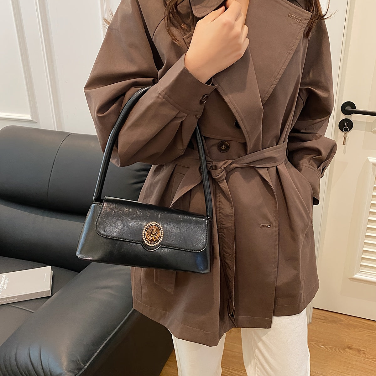 French vintage-style shoulder bag for women in elegant brown, with metal emblem, magnetic closure, and polyester lining. Versatile and stylish for daily use.