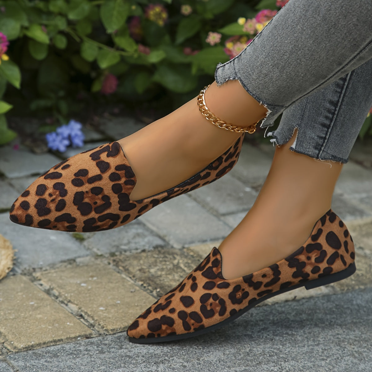 Leopard print slip-on flats with pointed toe and velvet upper.