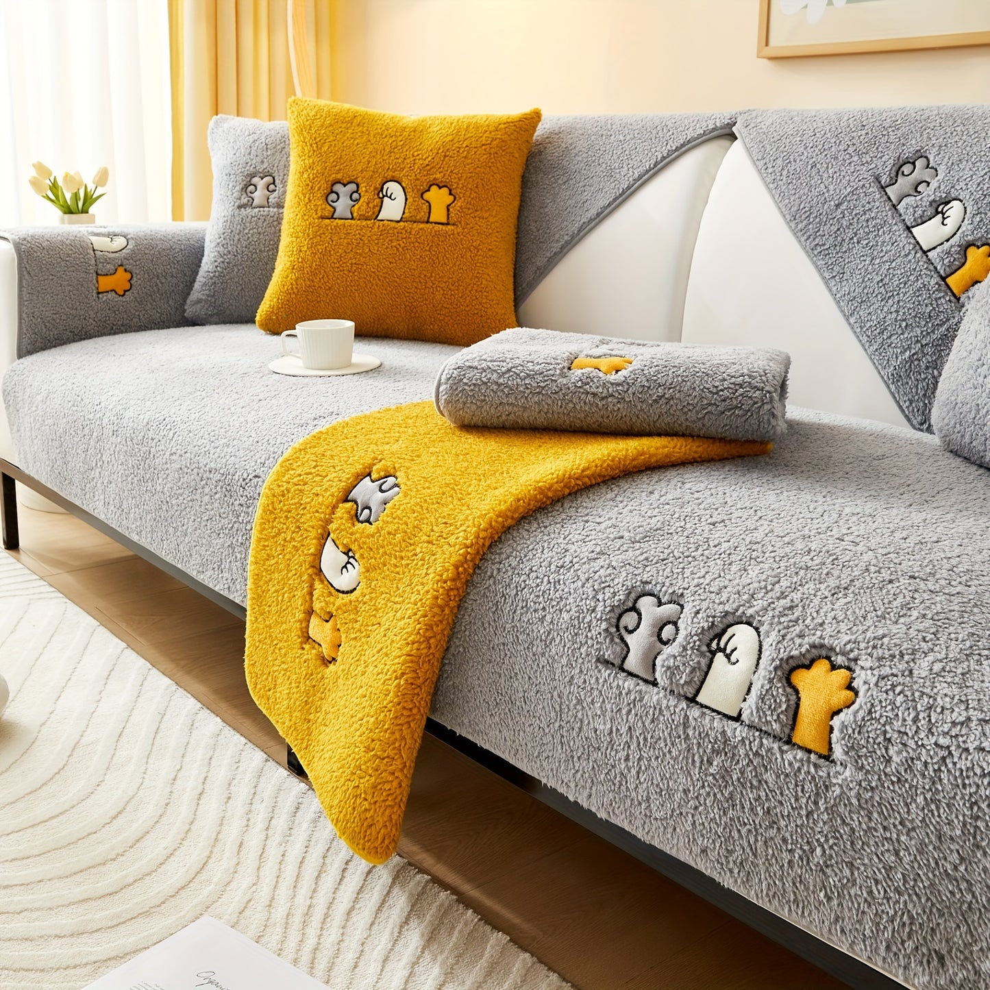 Modern plush sofa cover with paw pattern embroidery, non-slip protection for sofas, machine washable and suitable for various types of furniture.