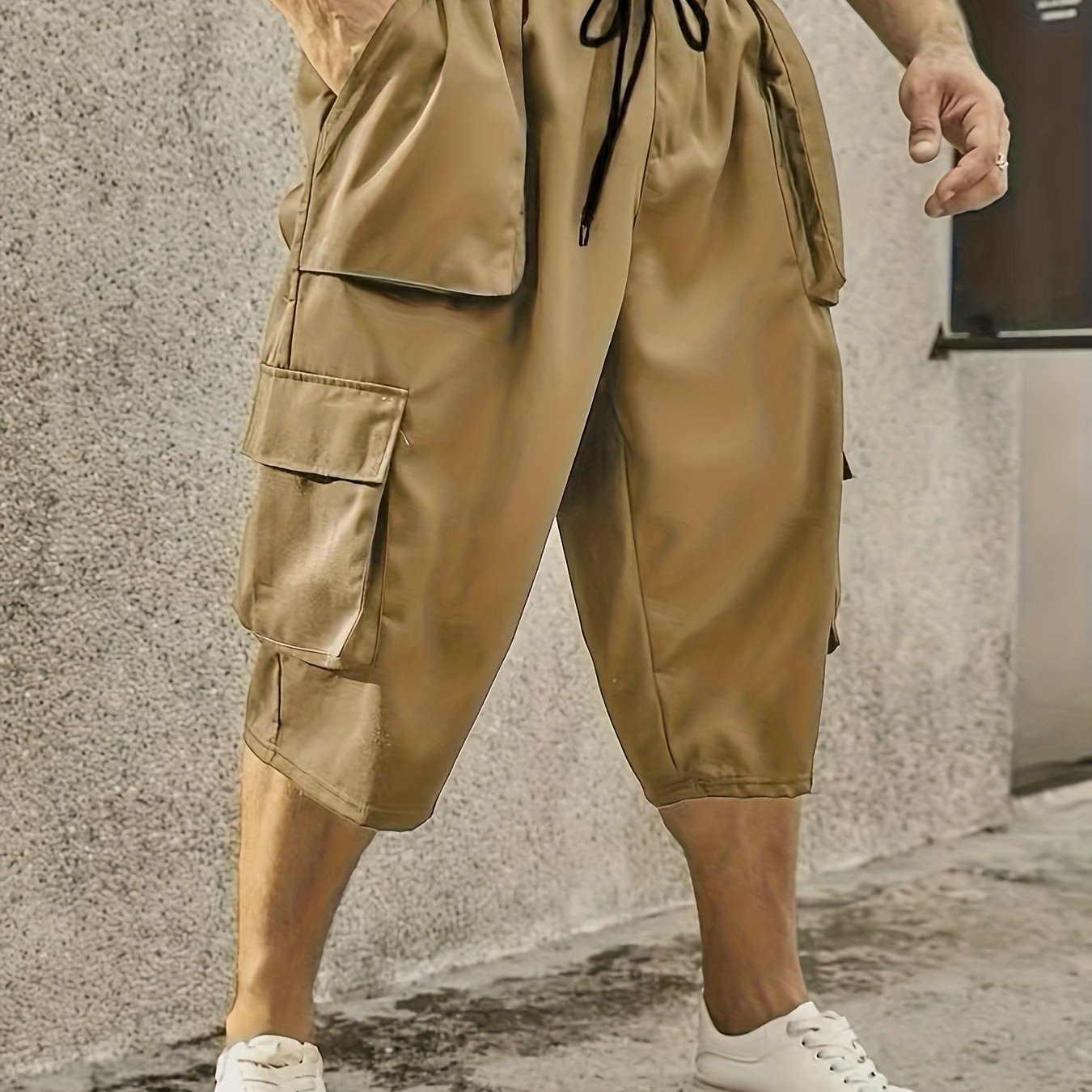 Men's plus size cargo pants with drawstring and pockets, loose fit, and comfortable breathability.