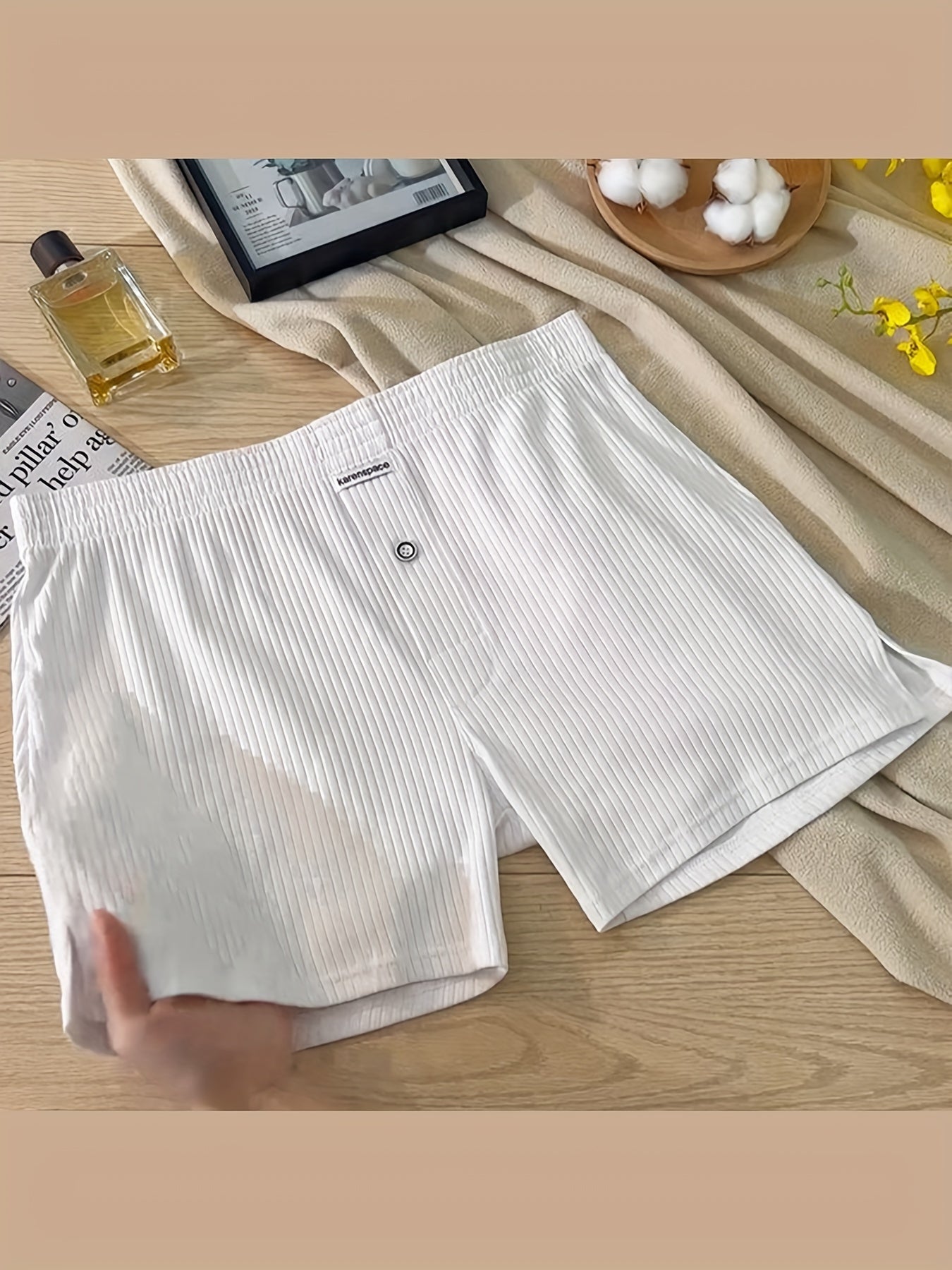 Cotton boxer shorts with button fly, loose fit and breathable for comfortable sleep and home wear.