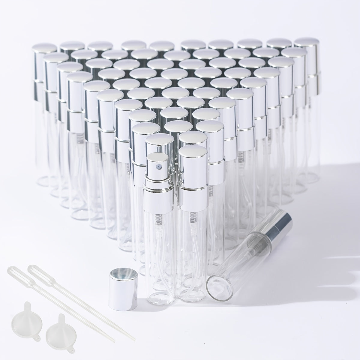 50 transparent glass bottles for decanting 5ml and 10ml perfumes, with spray tops.