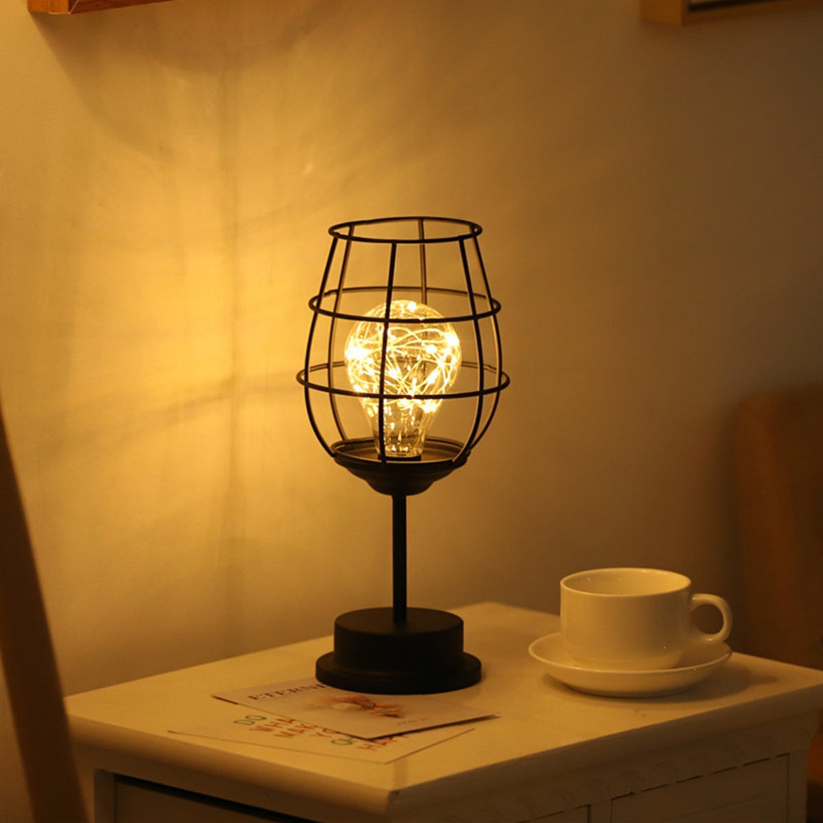 Modern accent light, krlviil Iron Wire Cage Design Night Light is a 0.5W Battery-Powered LED Lamp that provides decorative table lighting for the bedroom or living room. This light fits three AA batteries (batteries not included).