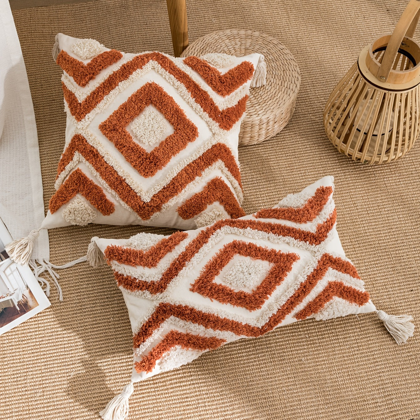 Vintage-inspired orange and white geometric tufted pillow cover with tassels made from 100% polyester. Features zip closure and is hand wash only. Ideal for living room and bedroom sofa decor.