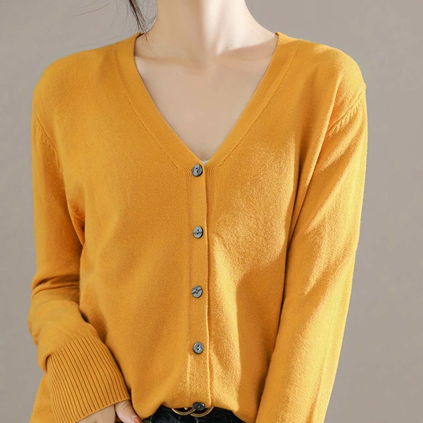 Chic V-neck cardigan with long sleeves, perfect for spring and fall.