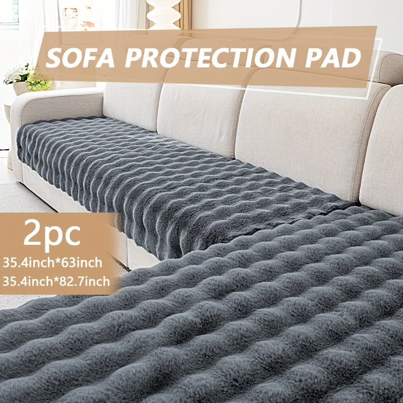 Luxurious faux rabbit fur sofa pads for winter warmth, pet-friendly, non-slip, machine washable, fits 2/3/4-seater sofas in grey color.