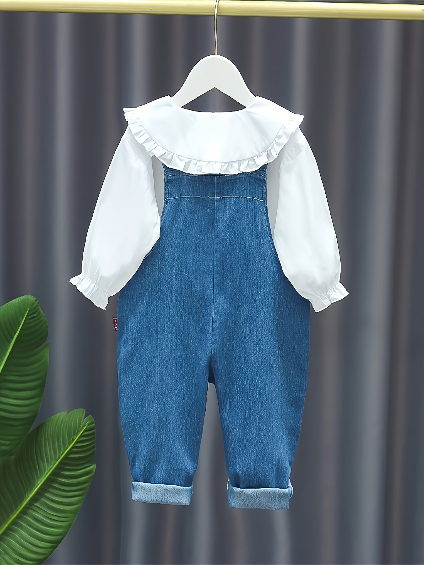 Baby girl's 2-piece denim overalls with rabbit embroidery plus ruffled blouse for spring and fall outdoor wear.