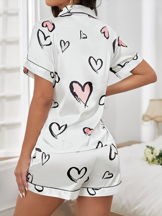 Valentine's Day pajama set featuring heart print satin, short sleeve button-up top, and elastic shorts for women's sleepwear and loungewear.