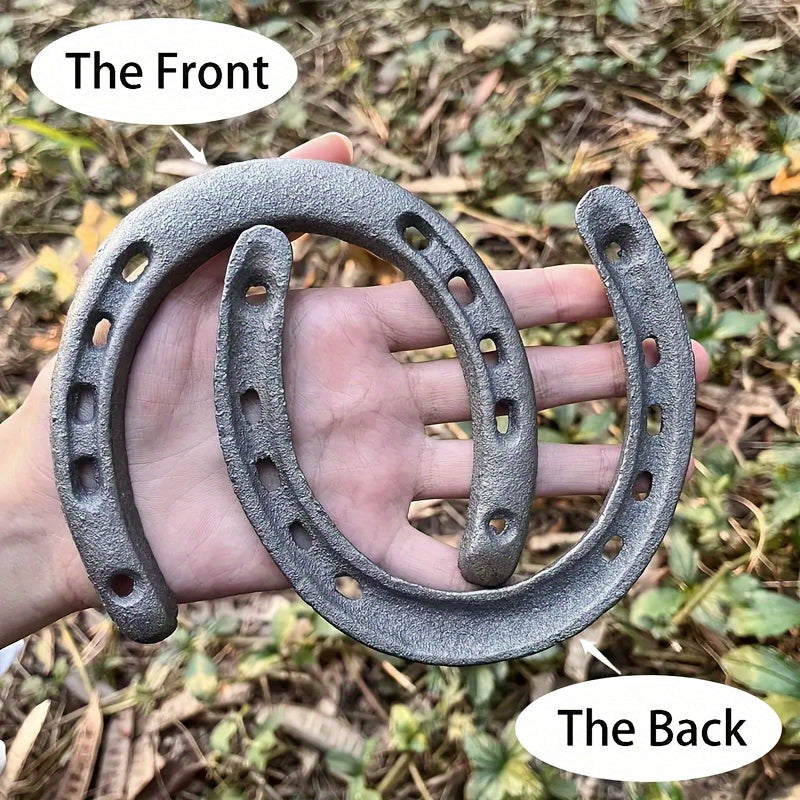 2 pieces of cast iron horseshoe crafts