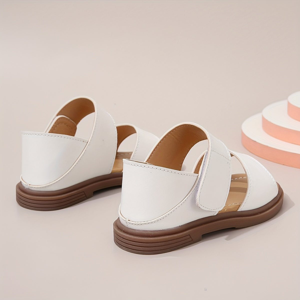 Stylish summer sandals for girls: open-toe design with braided straps and flat sole, ideal for casual wear and festivals.