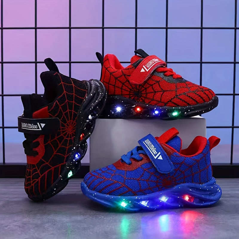 Durable rubber-soled boys' LED sneakers in red and blue with spider web design, breathable mesh, and hook-and-loop closure for casual wear and playtime.