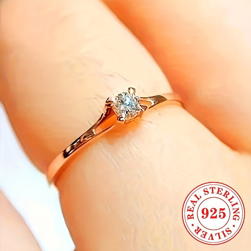 A woman purchased a 925 sterling silver engagement ring with a single stone zirconia, a simple yet elegant choice for her proposal and wedding day, a beautiful Valentine's Day gift.